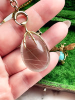 10k Rutile Quartz Egg w/ Avian Claw